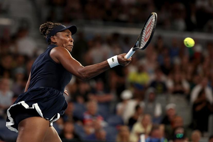 USA's Venus Williams hits a return to Serbia's Olga Danilovic during their women's singles match on day one of the Australian Open tennis tournament in Melbourne on January 18, 2026.  Martin KEEP / AFP