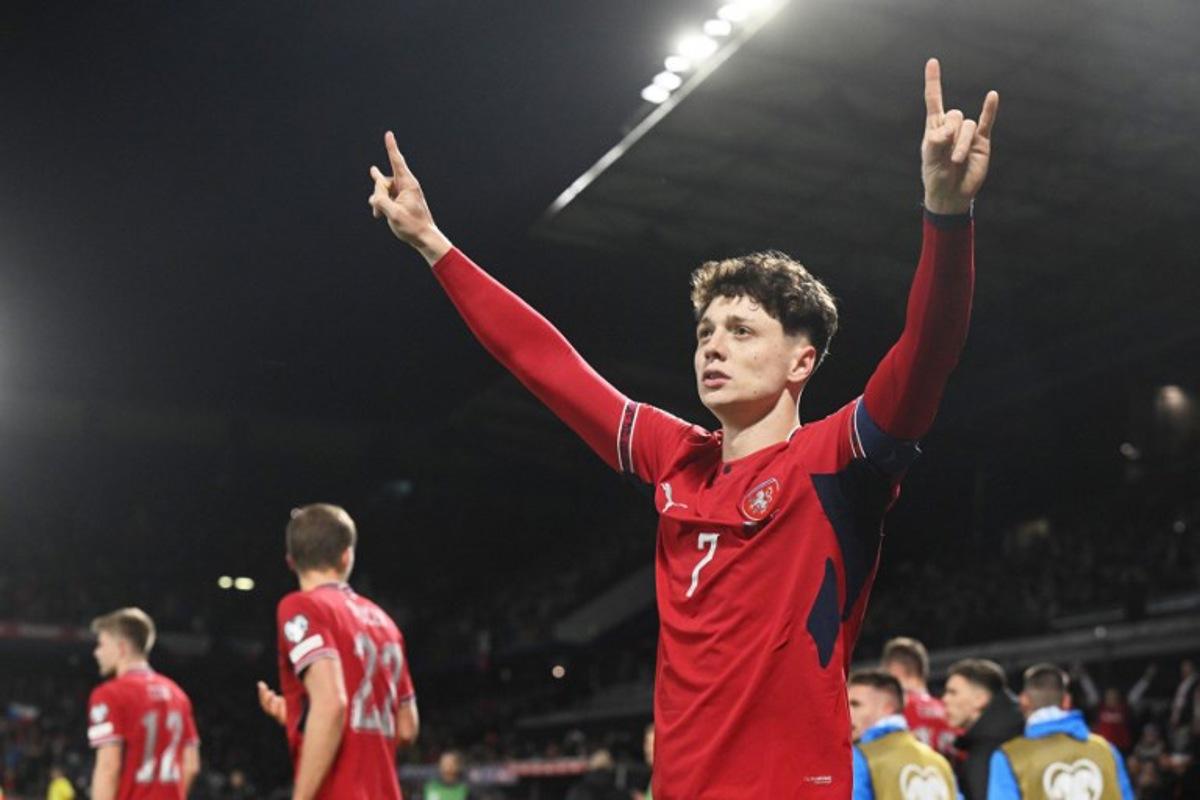 Czech Republic's defender #07 Ladislav Krejci celebrates after scoring the 2-1 goal during the first period of extra time during the FIFA World Cup 2026 European qualification final football match Czech Republic vs Denmark on March 31, 2026 in Prague, Czech Republic.  Michal Cizek / AFP
