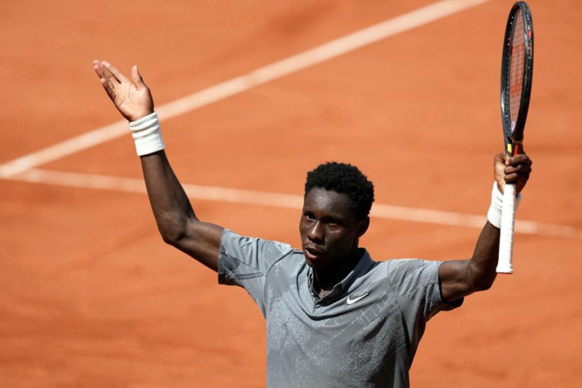 France's Moise Kouame reacts after winning a game as he plays against Paraguay's Adolfo Daniel Vallejo during their men's singles match on day 5 of the French Open tennis tournament on Court Suzanne-Lenglen at the Roland-Garros Complex in Paris on May 28, 2026.  Dimitar DILKOFF / AFP