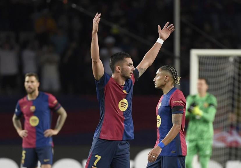 Barcelona's Spanish forward #07 Ferran Torres celebrates scoring his team's second goal with Barcelona's Brazilian forward #11 Raphinha (R) during the UEFA Champions League semi final first leg football match between FC Barcelona and Inter Milan at the Estadi Olimpic Lluis Companys in Barcelona on April 30, 2025.  Josep LAGO / AFP