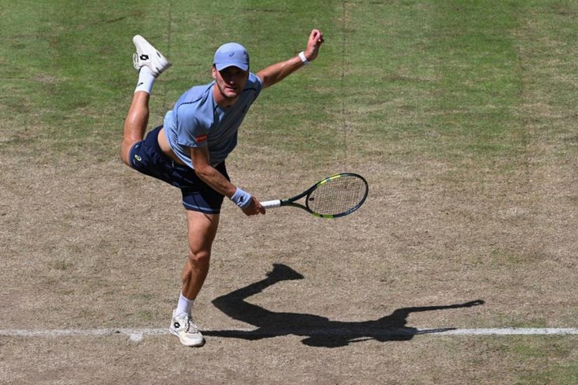 Belgium's Raphael Collignon returns the ball to Germany's Alexander Zverev during their men's singles quarter-final match of the Halle Open ATP tennis tournament in Halle, western Germany, on June 19, 2026.  CARMEN JASPERSEN / AFP