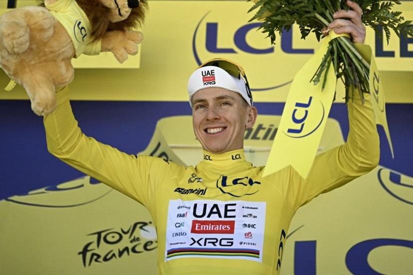 UAE Team Emirates - XRG's Slovenian rider Tadej Pogacar celebrates on the podium with the overall leader's yellow jersey after the 3rd stage of the 113th edition of the Tour de France cycling race, 196 km between Granollers and Les Angles in southern France, on July 6, 2026.  Loic VENANCE / AFP