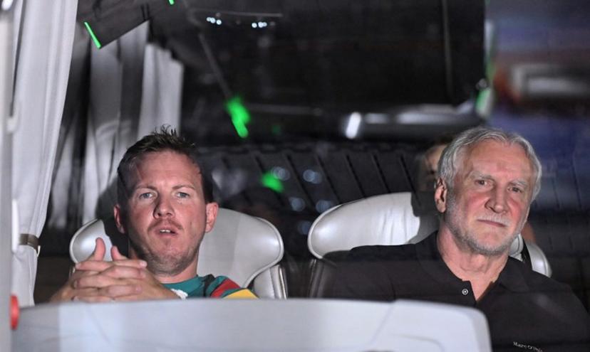 Germany's head coach Julian Nagelsmann (L) and the director of the German national team Rudi Voeller are seen inside the team bus upon arrival at the Mewa Arena Stadium prior to a friendly match between Germany and Finland ahead of the 2026 FIFA World Cup football tournament, in Mainz, western Germany on May 31, 2026.  Kirill KUDRYAVTSEV / AFP