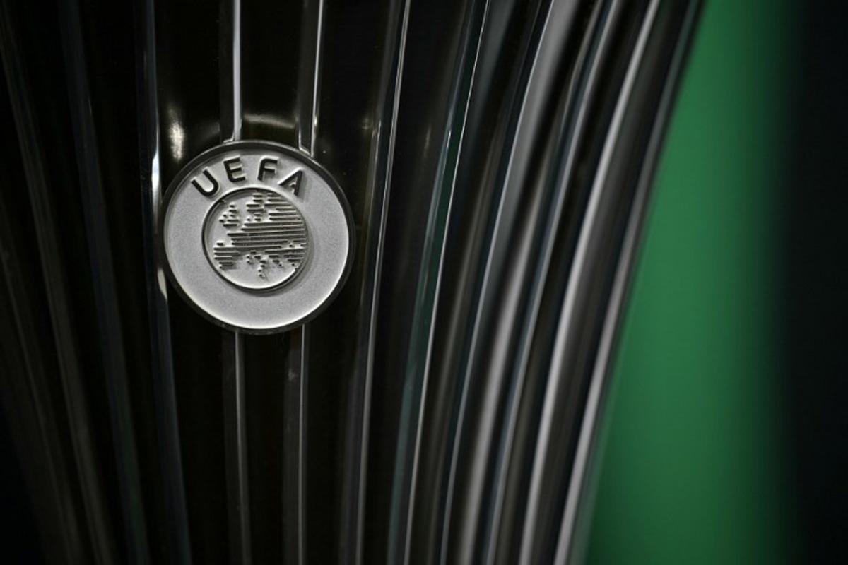 This photograph shows the UEFA logo displayed on the UEFA Conference League Cup ahead of the 2025-2026 UEFA Conference League round of 16, quarter-final and semi-final draw at the House of European Football in Nyon, western Switzerland on February 27, 2026.  Harold CUNNINGHAM / AFP