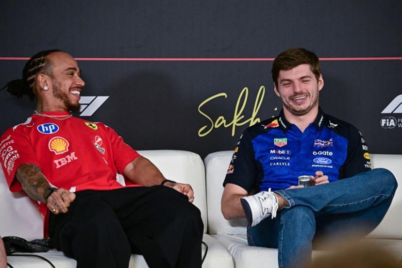 Ferrari's British driver Lewis Hamilton (L) and Red Bull Racing's Dutch driver Max Verstappen attend a press conference on the first day of the second Formula One pre-season test at the Bahrain International Circuit in Sakhir on February 18, 2026.  Giuseppe CACACE / AFP
