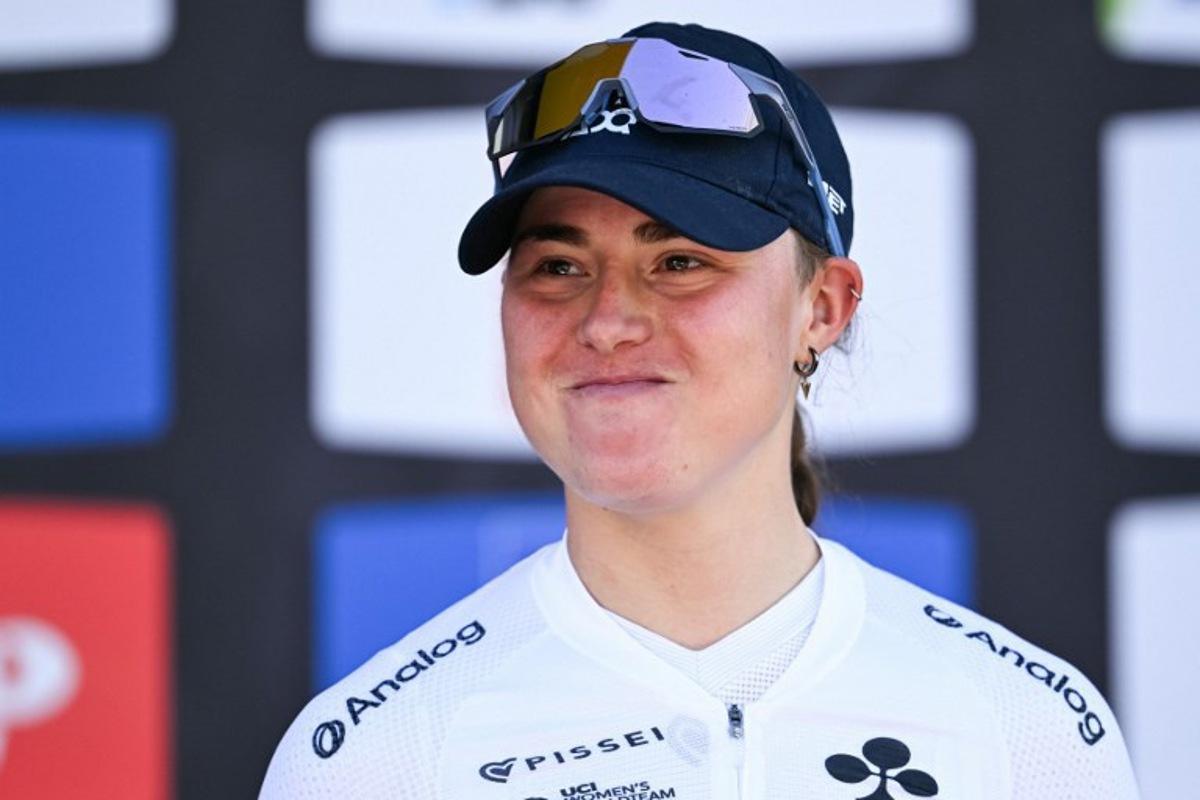 Third-placed UAE Team ADQ's Spanish Paula Blasi celebrates on the podium after 'La Fleche Wallonne' one day cycling race, 141 km from Huy to Huy, on April 22, 2026.  JOHN THYS / AFP