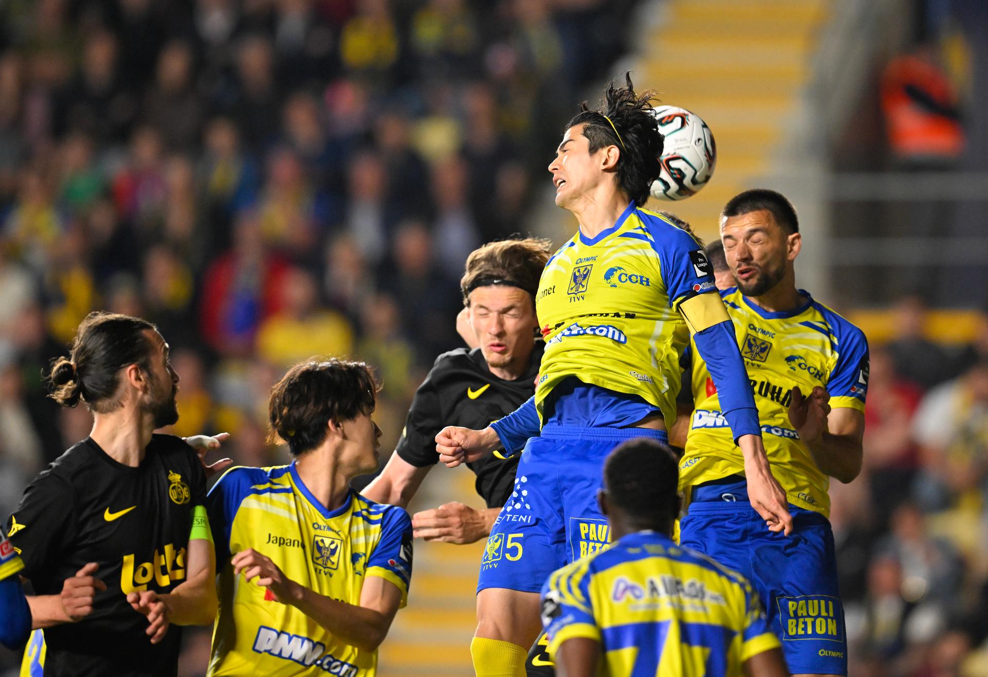 STVV's Shogo Taniguchi and STVV's Visar Musliu fight for the ball during a soccer match between Sint-Truiden VV and Royale Union Saint-Gilloise, Saturday 02 May 2026 in Sint-Truiden, on the sixth day of the Champion's Play-offs of the 2025-2026 'Jupiler Pro League' first division of the Belgian championship. BELGA PHOTO JOHN THYS