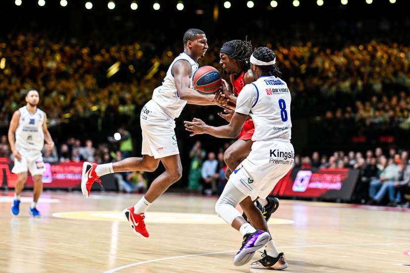 Mechelen's Nick Stampley, Antwerp's Rasheed Bello and Mechelen's Mojeed Oluwatobi Ewuosho pictured in action during a basketball match between Antwerp Giants and Kangoeroes Mechelen, Friday 30 January 2026 in Antwerp, during the Night of the Giants event on matchday 18/34 in the 'BNXT League' Belgian/ Dutch first division basket championship. BELGA PHOTO TOM GOYVAERTS