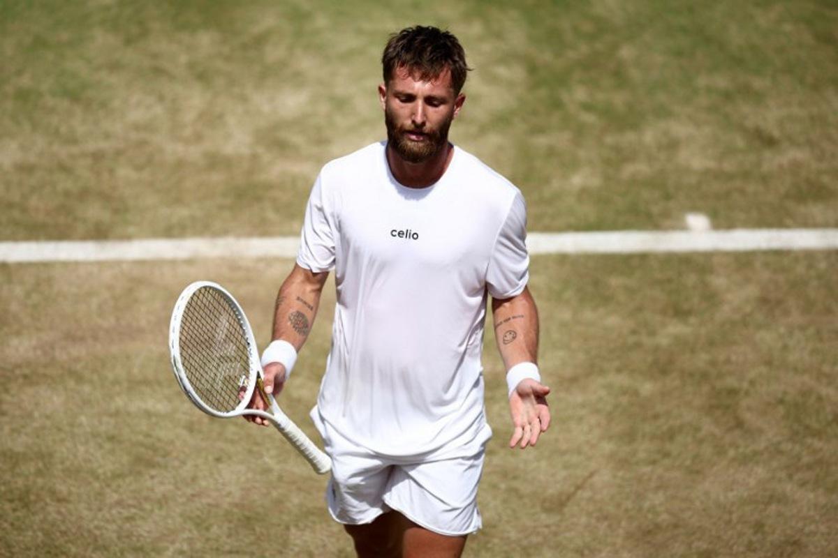 France's Corentin Moutet reacts after losing a point against Spain's Alejandro Davidovich Fokina during their men's singles round of 16 tennis match on day three of the ATP HSBC Championships at Queen's Club in west London on June 18, 2026. Fokina won the match 6-4, 6-3. Henry NICHOLLS / AFP