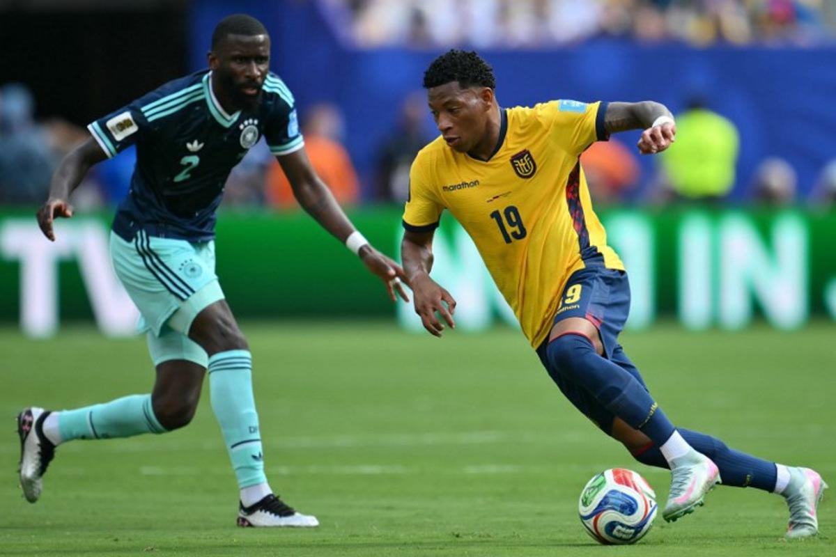 Germany's defender #02 Antonio Ruediger and Ecuador's midfielder #19 Gonzalo Plata fight for the ball during the 2026 World Cup Group E football match between Ecuador and Germany at the New York/New Jersey Stadium in East Rutherford on June 25, 2026.  ANGELA WEISS / AFP