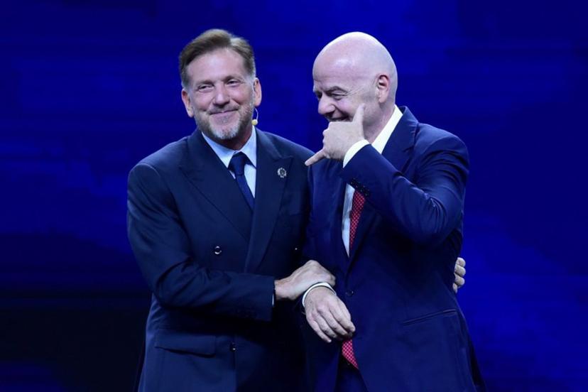 FIFA President Gianni Infantino (R) gestures next to CONMEBOL President Alejandro Dominguez (L) during a commemorative event marking the 10th anniversary of Dominguez's work as the head of the South American Football Confederation in Luque, Paraguay on January 26, 2026.  Daniel DUARTE / AFP