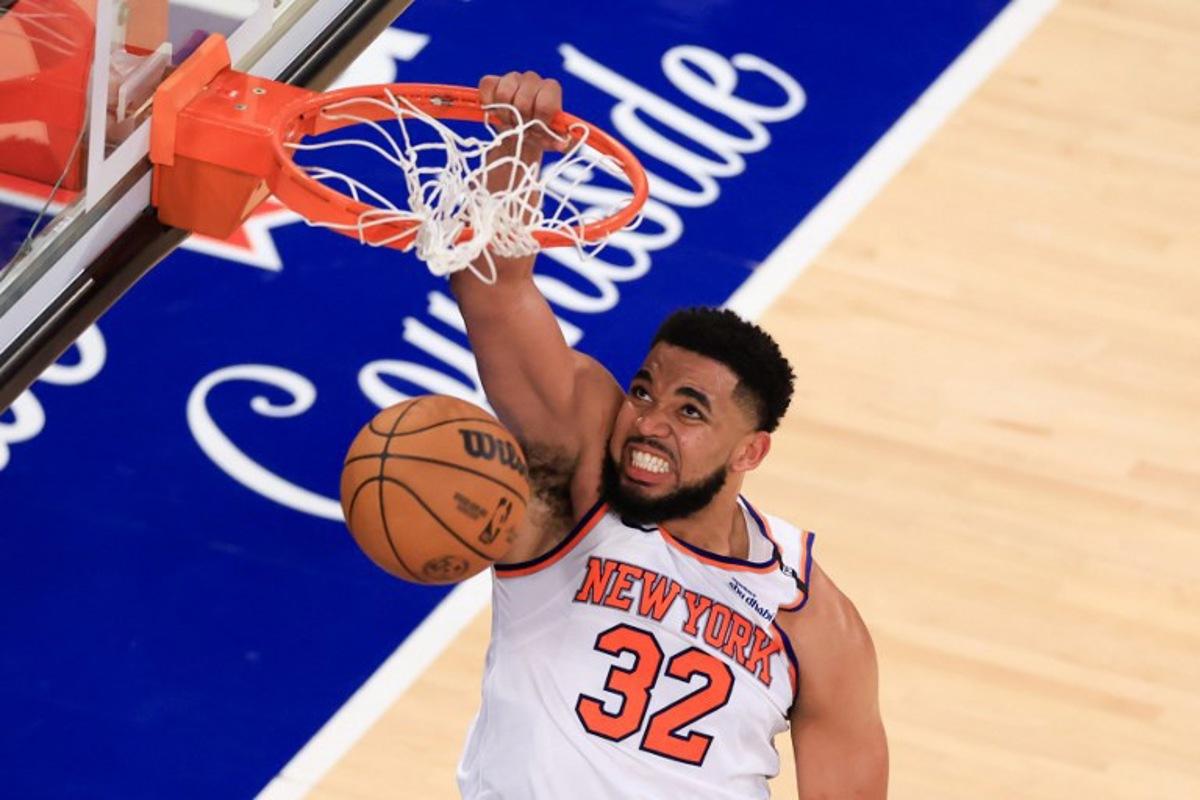 Knicks' center #32 Karl-Anthony Towns reacts after a dunk during Game Five of the Eastern Conference Finals of the 2025 NBA Playoffs between the New York Knicks and the Indiana Pacers at Madison Square Garden in New York on May 29, 2025.  CHARLY TRIBALLEAU / AFP