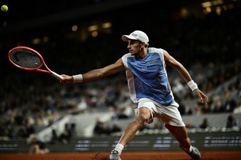 Italy's Matteo Arnaldi plays a backhand return to Italy's Matteo Berrettini during their men's quarter final singles match on day 11 of the French Open tennis tournament on Court Philippe-Chatrier at the Roland-Garros Complex in Paris on June 3, 2026.  JULIEN DE ROSA / AFP