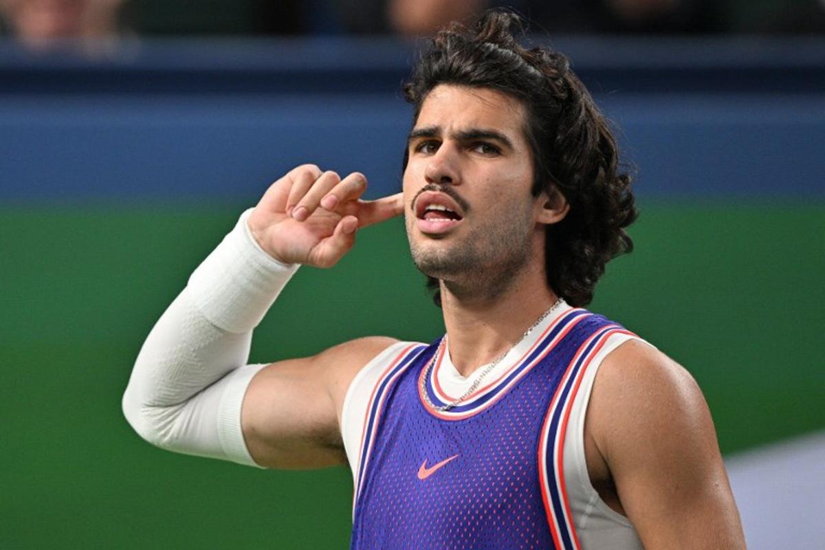 Spain's Carlos Alcaraz reacts during his men's singles match against Belgium's Zizou Bergs at the Shanghai Masters tennis tournament in Shanghai on October 12, 2026.  Hector RETAMAL / AFP