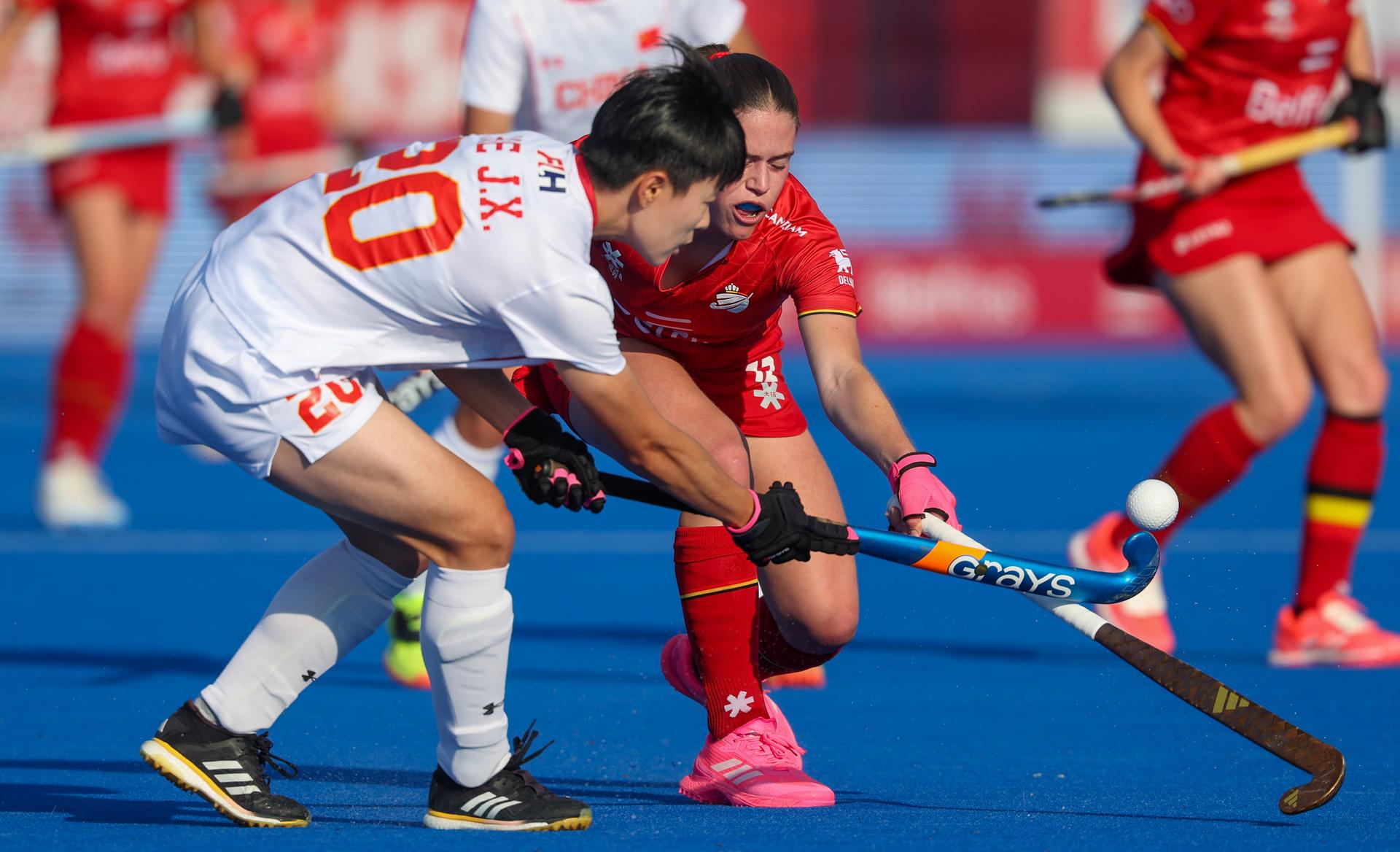 China's Jiangxin He and Belgium's Famke Van Heel fight for the ball during a hockey game between Belgian national team Red Panthers and China, Tuesday 16 June 2026 in Wavre, match 10/16 in the group stage of the women's FIH Pro League competition. BELGA PHOTO VIRGINIE LEFOUR