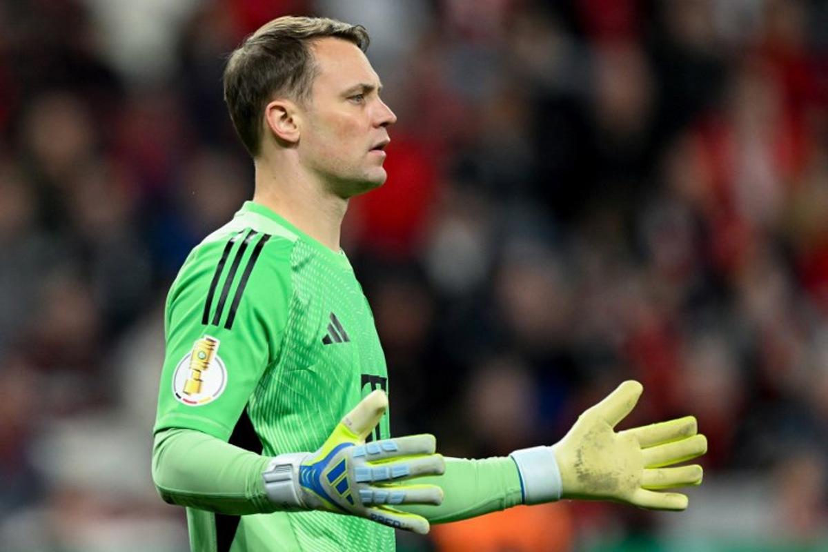 Bayern Munich's German goalkeeper #01 Manuel Neuer reacts during the German Cup (DFB-Pokal) semi-final football match between Bayer 04 Leverkusen and FC Bayern Munich in Leverkusen, western Germany on April 22, 2026.  INA FASSBENDER / AFP