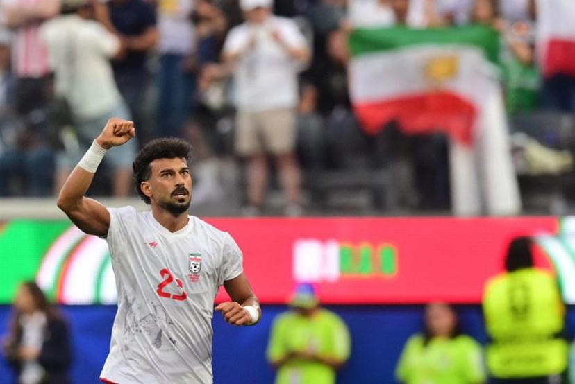 Iran's defender #23 Ramin Rezaeian celebrates scoring his team's first goal during the 2026 World Cup Group G football match between Iran and New Zealand at Los Angeles Stadium in Inglewood on June 15, 2026.   Frederic J. Brown / AFP