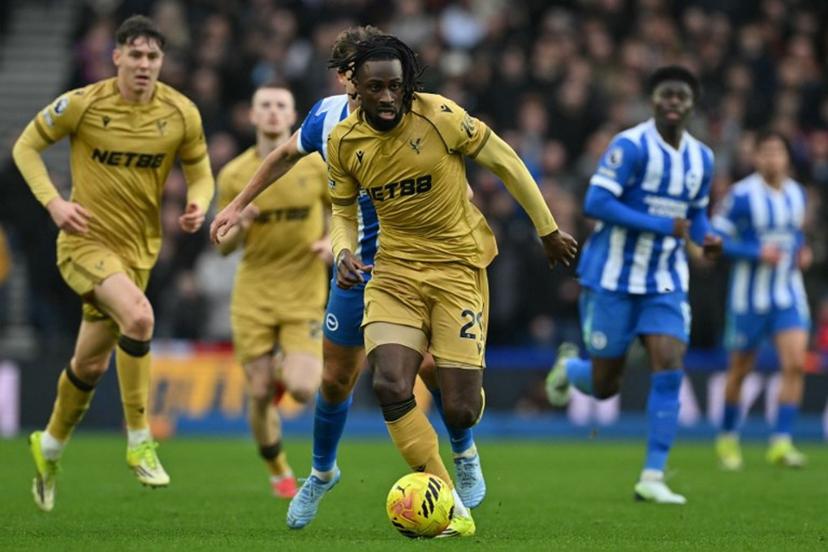 Crystal Palace's Ivorian striker #29 Evann Guessand runs with the ball during the English Premier League football match between Brighton and Hove Albion and Crystal Palace at the American Express Community Stadium in Brighton, southern England on February 8, 2026.  Glyn KIRK / AFP
