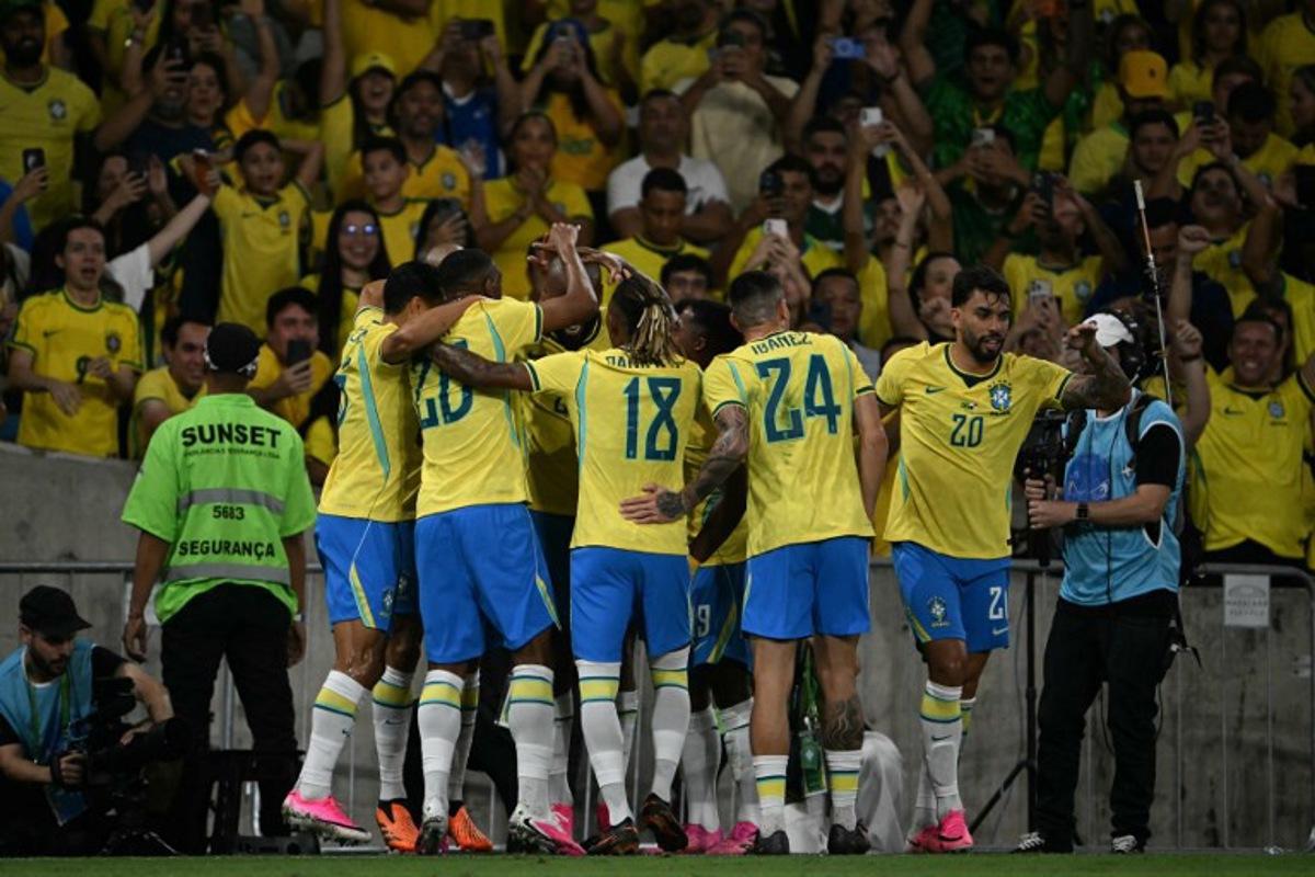 Brazil's forward #25 Igor Thiago (C, unseen) celebrates a penalty goal with teammates during the international friendly football match between Brazil and Panama at the Maracana stadium in Rio de Janeiro, Brazil on May 31, 2026.  Mauro PIMENTEL / AFP