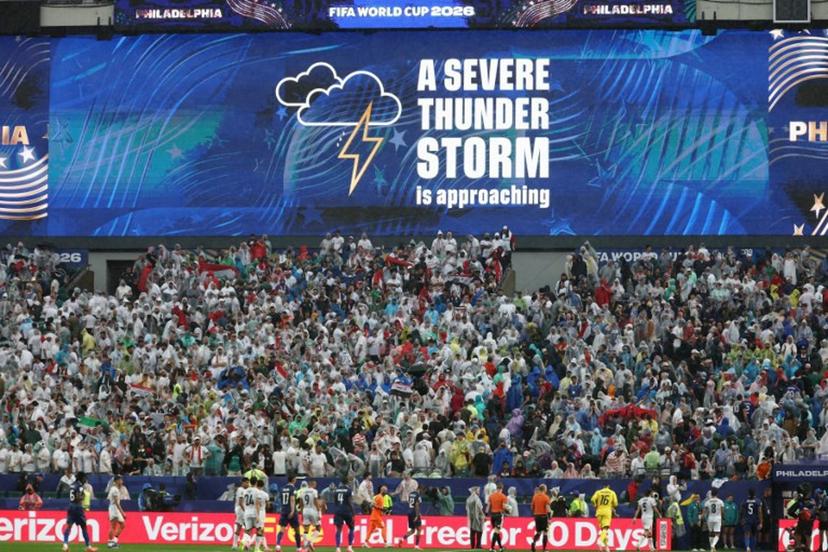 A screen shows a severe thunder storm warning during the 2026 World Cup Group I football match between France and Iraq at the Philadelphia Stadium in Philadelphia on June 22, 2026.   FRANCK FIFE / AFP