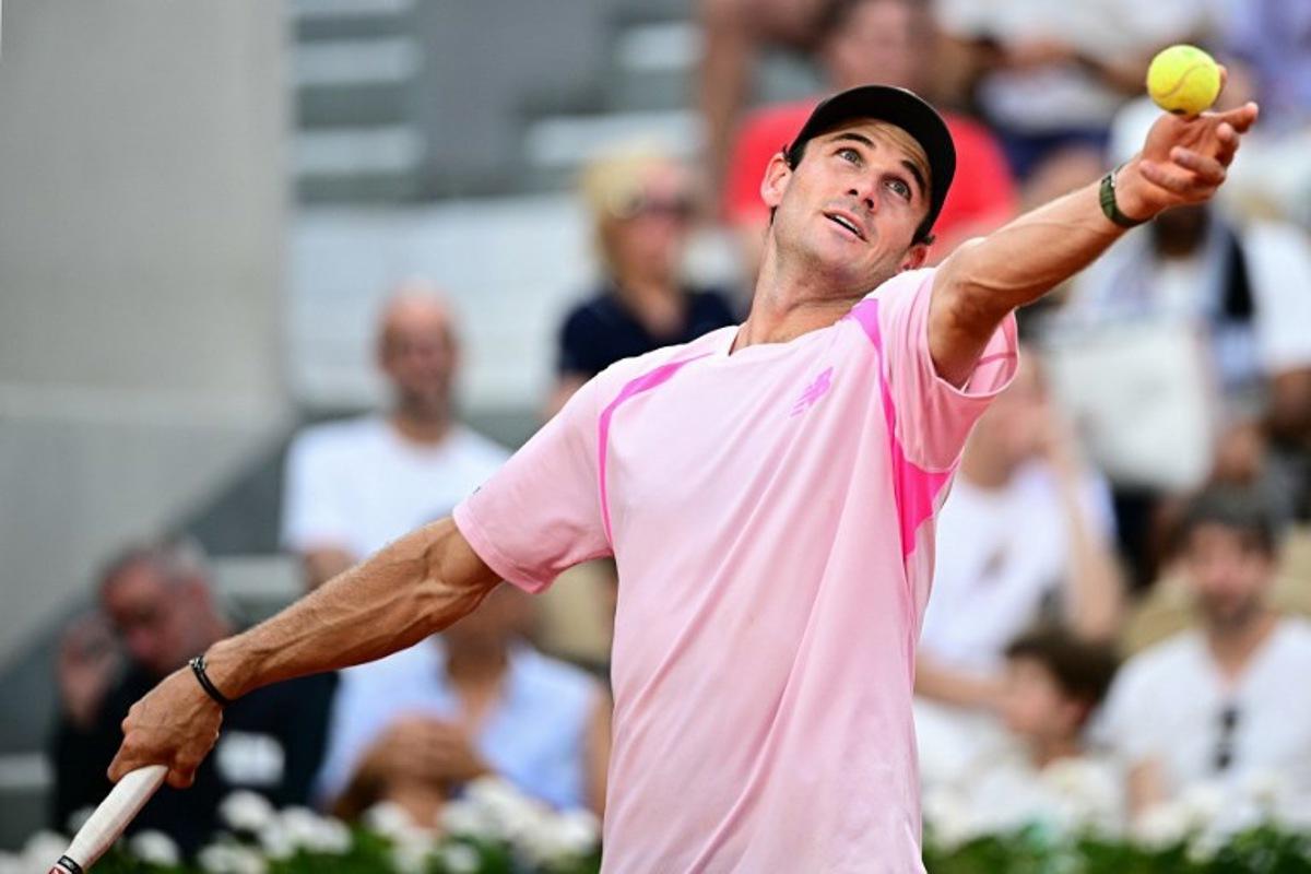 US Tommy Paul serves to Norway's Casper Ruud during their men's singles match on day 6 of the French Open tennis tournament on Court Suzanne-Lenglen at the Roland-Garros Complex in Paris on May 29, 2026.  JULIEN DE ROSA / AFP
