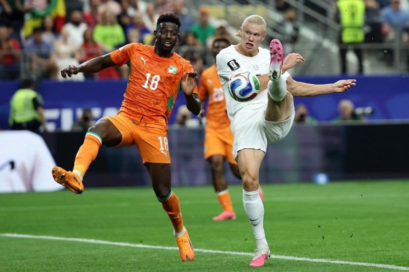 Norway's forward #09 Erling Braut Haaland (R) kicks the ball next to Ivory Coast's midfielder #18 Ibrahim Sangare during the 2026 World Cup round of 32 football match between Ivory Coast and Norway at the Dallas Stadium in Arlington on June 30, 2026.   Aric Becker / AFP