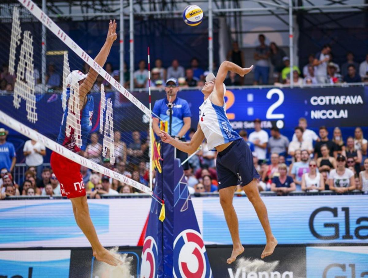 Norway's Christian Sorum and Anders Mol compete against Italy's Paolo Nicolai and Samuele Cottafava during the men's gold medal match of the BeachVolley Nations Cup between Italy and Norway in Vienna, Austria on August 7, 2022.  Eva MANHART / APA / AFP