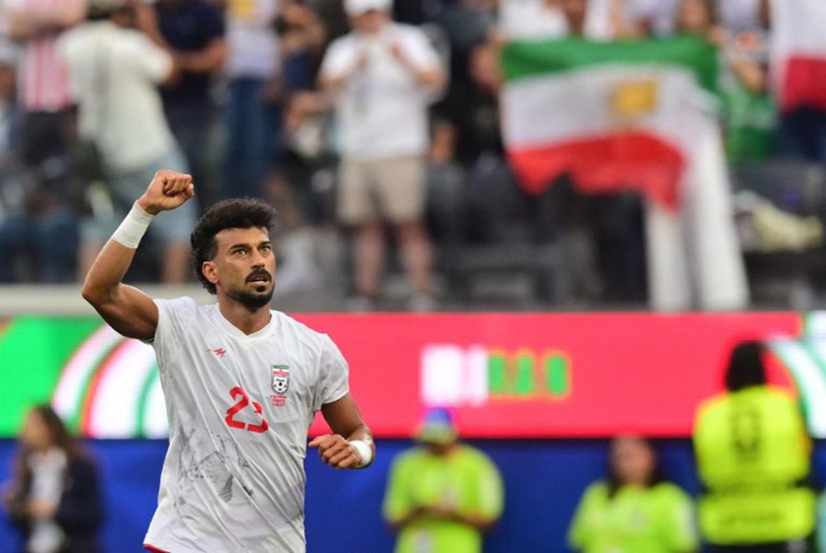 Iran's defender #23 Ramin Rezaeian celebrates scoring his team's first goal during the 2026 World Cup Group G football match between Iran and New Zealand at Los Angeles Stadium in Inglewood on June 15, 2026.   Frederic J. Brown / AFP