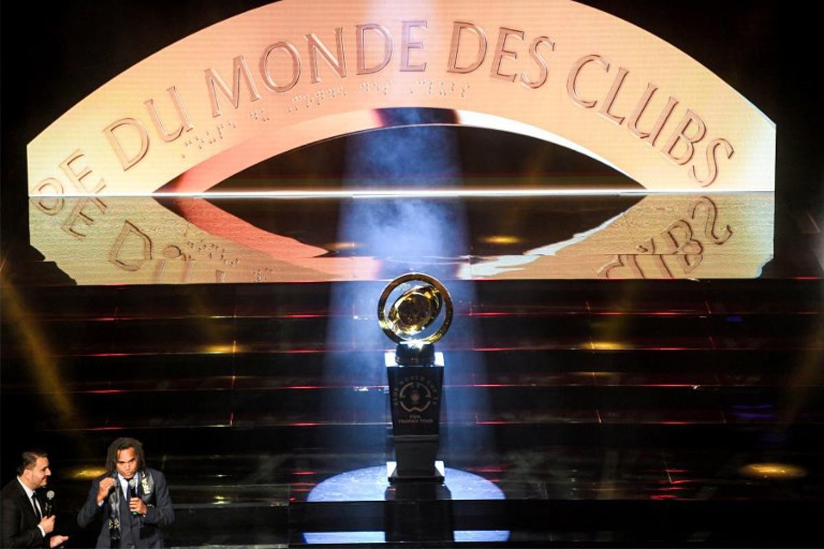 France's former football midfielder and FIFA World Cup winner Christian Karembeu (2nd-L) presents the FIFA Club World Cup trophy during a ceremony organised by Tunisian club Esperance de Tunis in Tunis on February 15, 2025. Tunisia's Esperance is one of the clubs taking part in the 2025 FIFA Club World Cup championship in June in the United States. FETHI BELAID / AFP