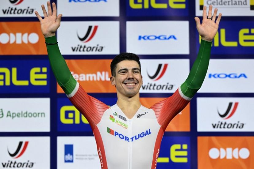 First placed Portugal's Iuri Leitao celebrates on the podium for the Men's Scratch race during the third day of the UEC European Track Cycling Championships at the Omnisport indoor arena in Apeldoorn, on January 12, 2024.  JOHN THYS / AFP