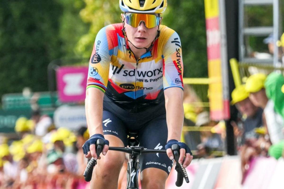 Team SD Worx-Protime's Belgian rider Lotte Kopecky crosses the finish line to finish in second-placed in the 3rd (out of 9) stage of the fifth edition of the Women's Tour de France cycling race, 156.5 km from Geneva to Poligny, in Poligny, central-eastern France on August 3, 2026.  NICOLAS TUCAT / AFP