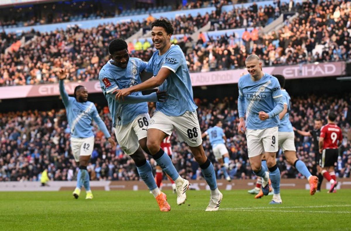 Manchester City's English defender #68 Max Alleyne (C) celebrates scoring the opening goal during the English FA Cup third round football match between Manchester City and Exeter City at the Etihad Stadium in Manchester, north west England, on January 10, 2026.  Oli SCARFF / AFP
