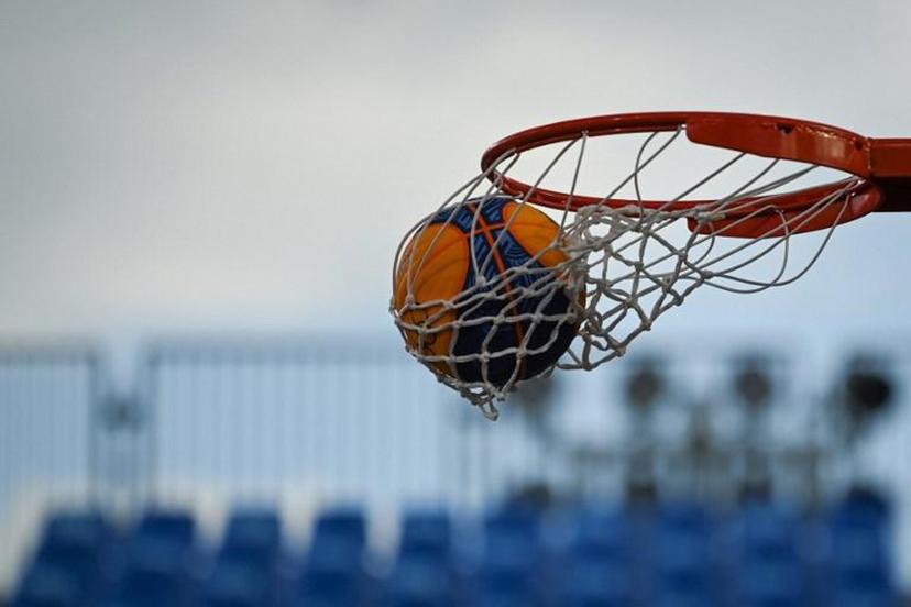 The ball is pictured entering the basket during the women's first round 3x3 basketball match between France and Romania at the Aomi Urban Sports Park in Tokyo, on July 27, 2021 during the Tokyo 2020 Olympic Games.  Ina FASSBENDER / AFP