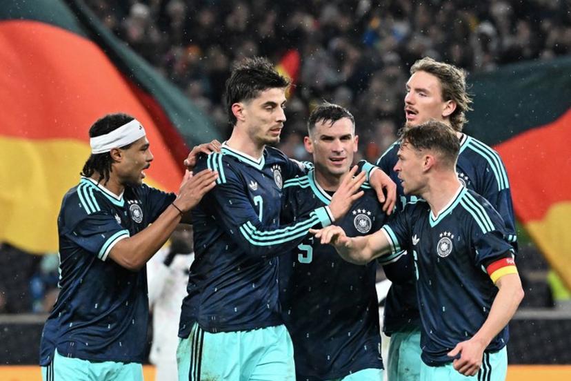 (From L) Germany's midfielder #20 Serge Gnabry, Germany's forward #07 Kai Havertz,  Germany's midfielder #05 Pascal Gross, Germany's forward #11 Nick Woltemade and Germany's defender #06 Joshua Kimmich celebrate their team's first goal scored by Havertz during the international friendly football match between Germany and Ghana in Stuttgart, southwestern Germany on March 30, 2026.  THOMAS KIENZLE / AFP