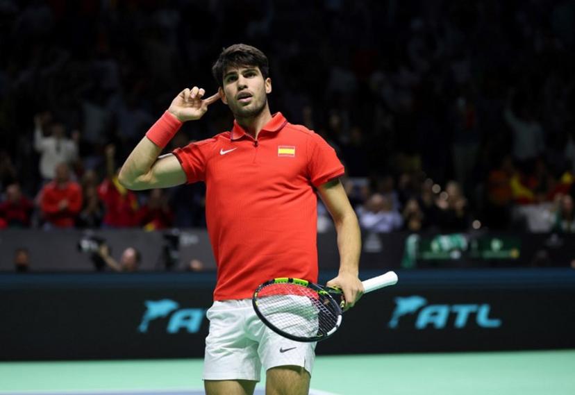 Spain's Carlos Alcaraz reacts in the quarter-final doubles match between Netherlands and Spain during the Davis Cup Finals at the Palacio de Deportes Jose Maria Martin Carpena arena in Malaga, southern Spain, on November 19, 2024.  Thomas COEX / AFP
