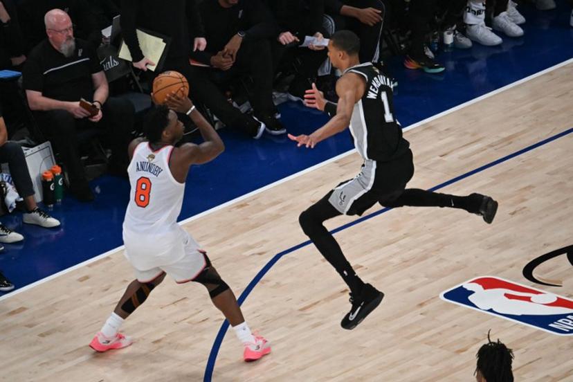 San Antonio Spurs' French forward-center #01 Victor Wembanyama jumps as Nicks' British-US player #08 OG Anunoby prepares to throw during Game Three of the NBA Finals between the San Antonio Spurs and the New York Knicks at Madison Square Garden in New York on June 8, 2026.  SAUL LOEB / AFP