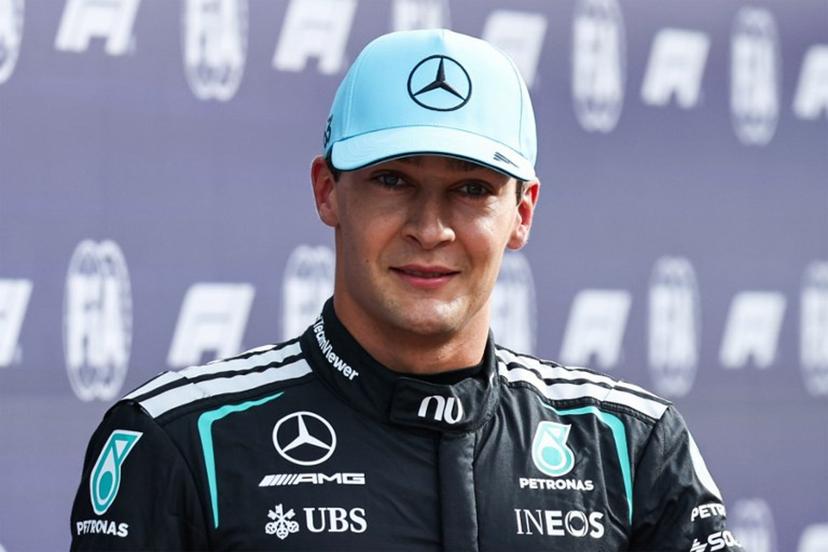 Mercedes' British driver George Russell celebrates his pole position after the sprint qualifying session of the Formula One Dutch Grand Prix at The Circuit Zandvoort, western Netherlands, on August 21, 2026.  SIMON WOHLFAHRT / AFP