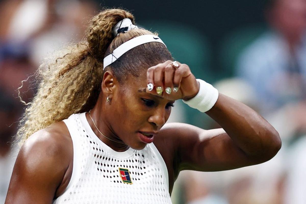 US player Serena Williams reacts as she plays against Australia's Maya Joint during their women's singles first round tennis match on the second day of the 2026 Wimbledon Championships at The All England Lawn Tennis and Croquet Club in Wimbledon, southwest London, on June 30, 2026.  HENRY NICHOLLS / AFP