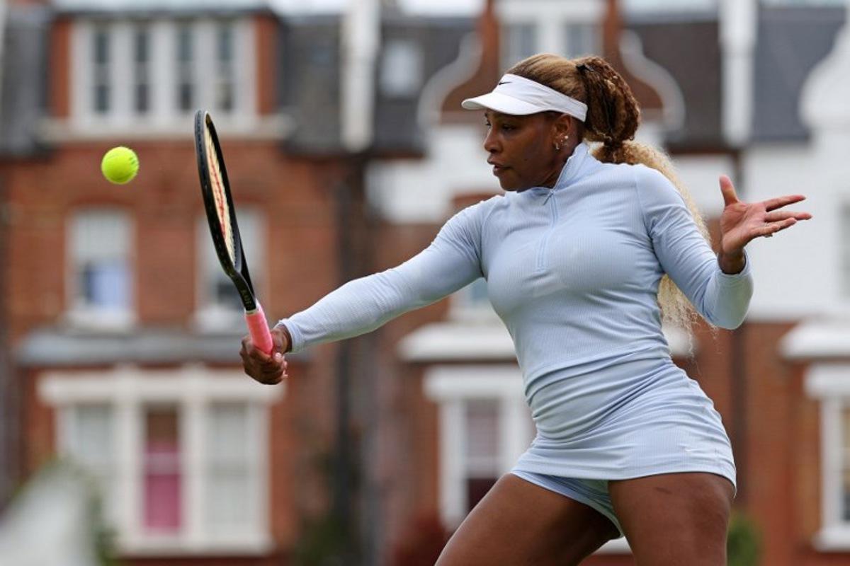US player Serena Williams hits a shot during a practice session at the HSBC WTA tennis Championships at Queen's Club in west London on June 12, 2026. Serena Williams' bid to win the Queen's Club doubles title on her return to tennis came to a premature end on Thursday after the American legend's partner Victoria Mboko was forced to withdraw from the tournament. Adrian Dennis / AFP