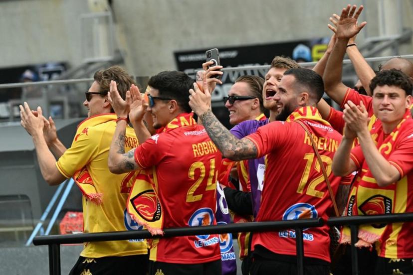 French Ligue 2 football team Le Mans' players applaud the riders during the Moto2 race as part of the Moto GP Grand Prix of France weekend at Le Mans, northwestern France, on May 10, 2026.  Loic VENANCE / AFP