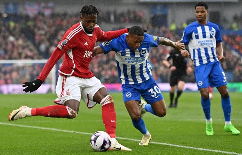 Brighton's Ecuadorian defender #30 Pervis Estupinanm (R) vies with Nottingham Forest's Belgian striker #27 Divock Origi during the English Premier League football match between Brighton and Hove Albion and Nottingham Forest at the American Express Community Stadium in Brighton, southern England on March 10, 2024.  Glyn KIRK / AFP