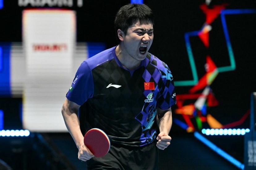 China's Liang Jingkun celebrates winning a game against France's Alexis Lebrun during their Men's Teams semi-final match at the ITTF World Table Tennis Championships in Wembley Arena, west London on May 9, 2026.  Glyn KIRK / AFP
