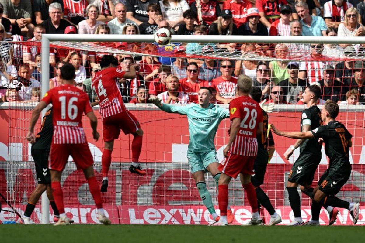 Freiburg's Japanese midfielder #14 Yuito Suzuki scores the team's first goal during the German first division Bundesliga football match between SC Freiburg and Werder Bremen in Freiburg, southern Germany, on August 30, 2026.  THOMAS KIENZLE / AFP