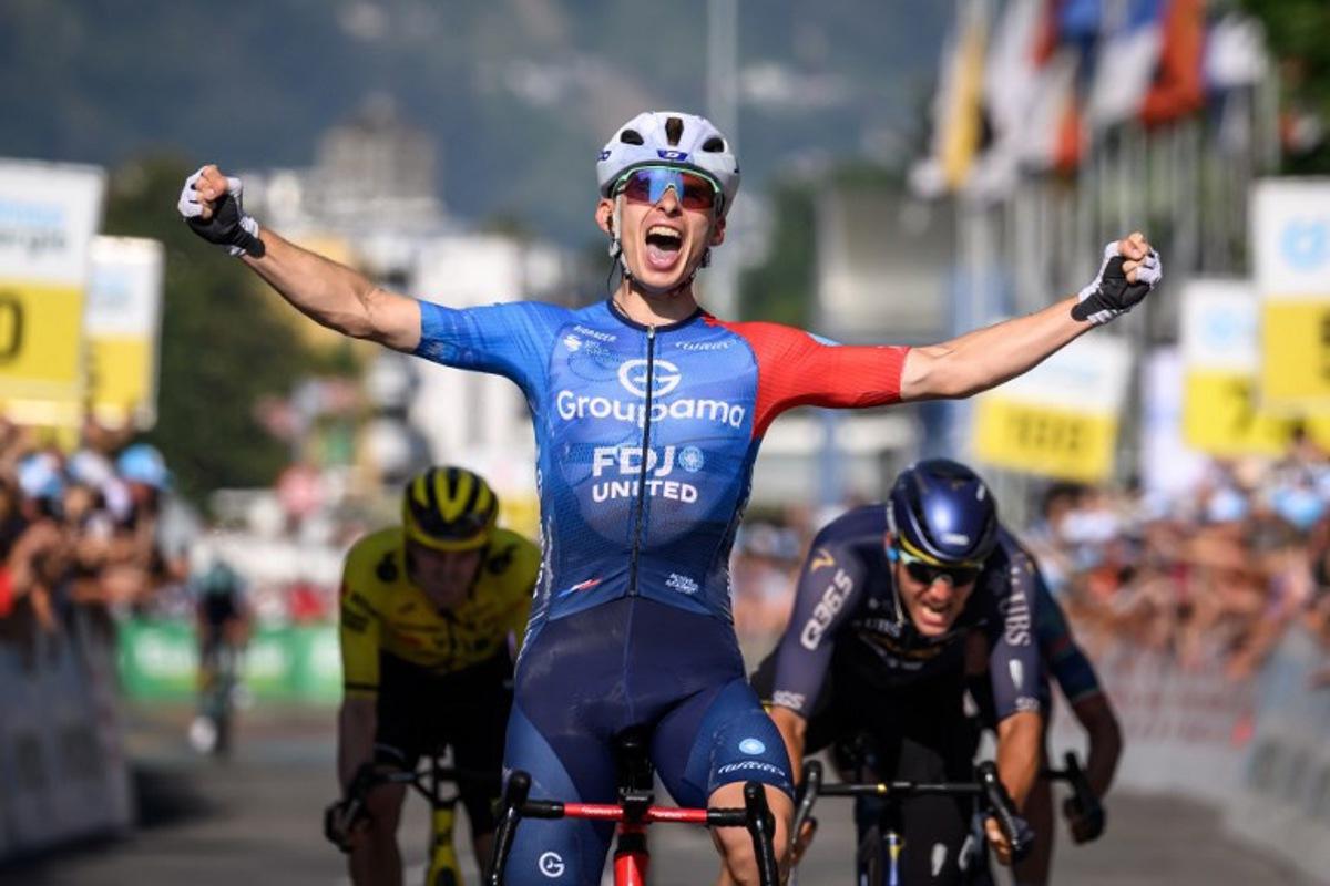 Groupama-FDJ's French rider Romain Gregoire celebrates as he crosses the finish line to win the second stage 157,7km from Locarno to Locarno at the Men's Tour of Switzerland (Tour de Suisse) cycling race in Locarno, Switzerland, on June 18, 2026.  Fabrice COFFRINI / AFP