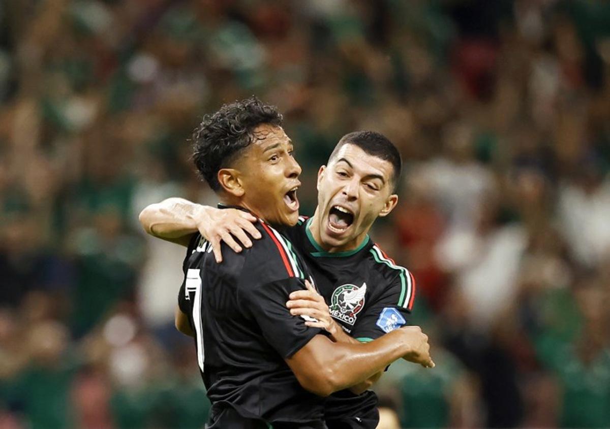 Mexico's midfielder #07 Luis Romo celebrates with teammate midfielder #06 Erik Lira scoring his team's first goal during the 2026 World Cup Group A football match between Mexico and South Korea at the Guadalajara Stadium in Zapopan on June 18, 2026.   Ulises RUIZ / AFP