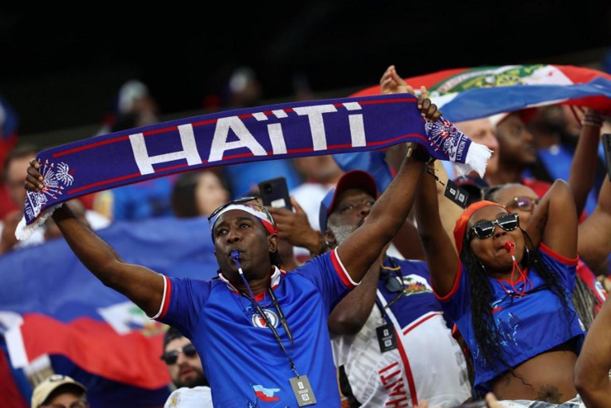 Haiti fans cheer ahead of the 2026 World Cup Group C football match between Haiti and Scotland at the Boston Stadium in Foxborough on June 13, 2026.  FRANCK FIFE / AFP