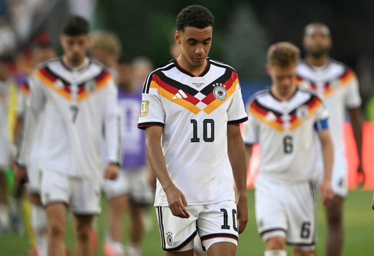 Germany's midfielder #10 Jamal Musiala reacts after losing the penalty shootout during the 2026 World Cup round of 32 football match between Germany and Paraguay at the Boston Stadium in Foxborough on June 29, 2026.   MAURO PIMENTEL / AFP