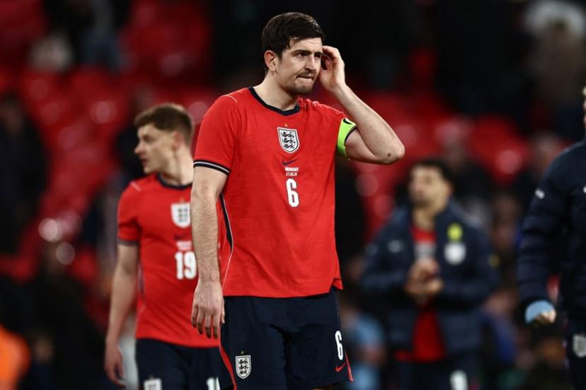 England's defender Harry Maguire reacts on the pitch after the friendly International football match between England and Uruguay at Wembley Stadium, west London, on March 27, 2026. The game finished 1-1. Henry NICHOLLS / AFP