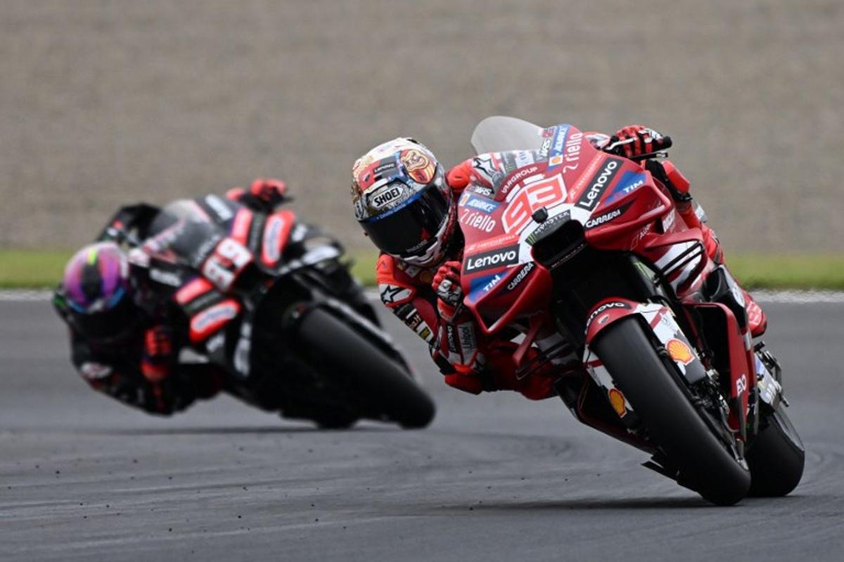 Ducati Lenovo Team rider Marc Marquez of Spain leads Aprilia Racing rider Jorge Martin of Spain during the MotoGP Japanese Grand Prix at the Mobility Resort Motegi in Motegi, Tochigi prefecture on October 4, 2026.   Toshifumi KITAMURA / AFP