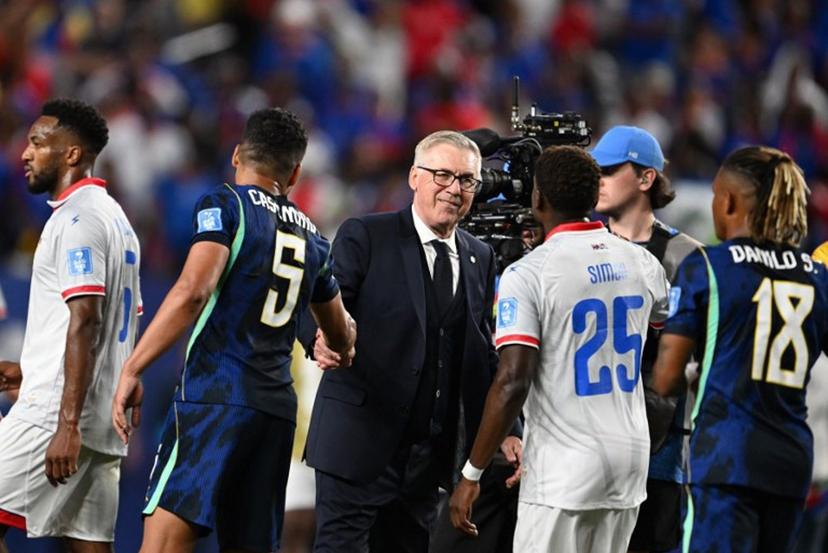 Brazil's Italian head coach Carlo Ancelotti shakes hands with midfielder #05 Casemiro past Haiti's midfielder #25 Dominique Simon after the 2026 World Cup Group C football match between Brazil and Haiti at the Philadelphia Stadium in Philadelphia on June 19, 2026.   ROBERTO SCHMIDT / AFP